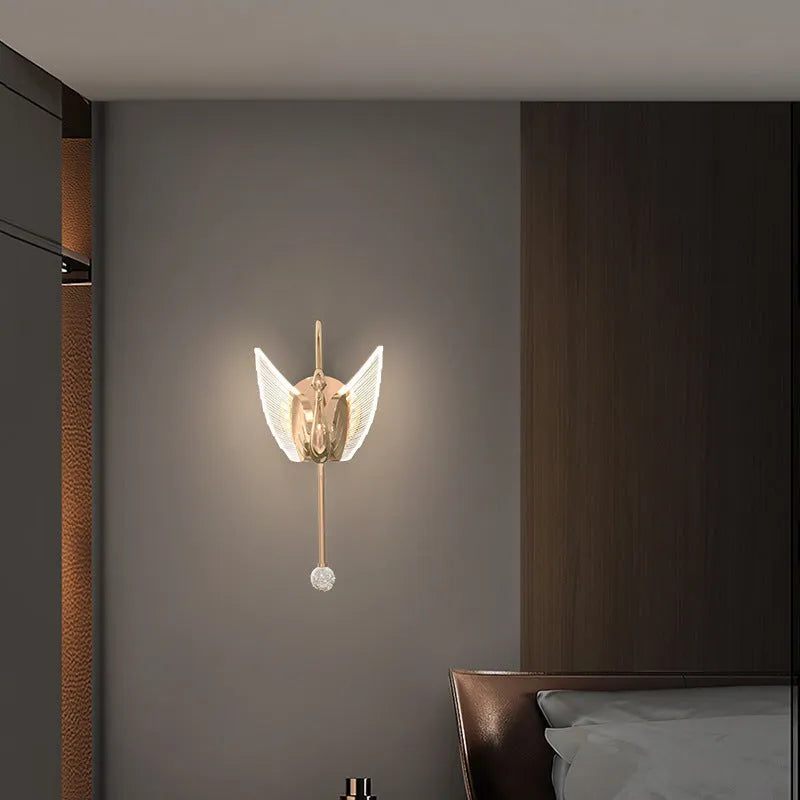 Gold swan design wall lamp with acrylic shade showing LED lighting and iron construction