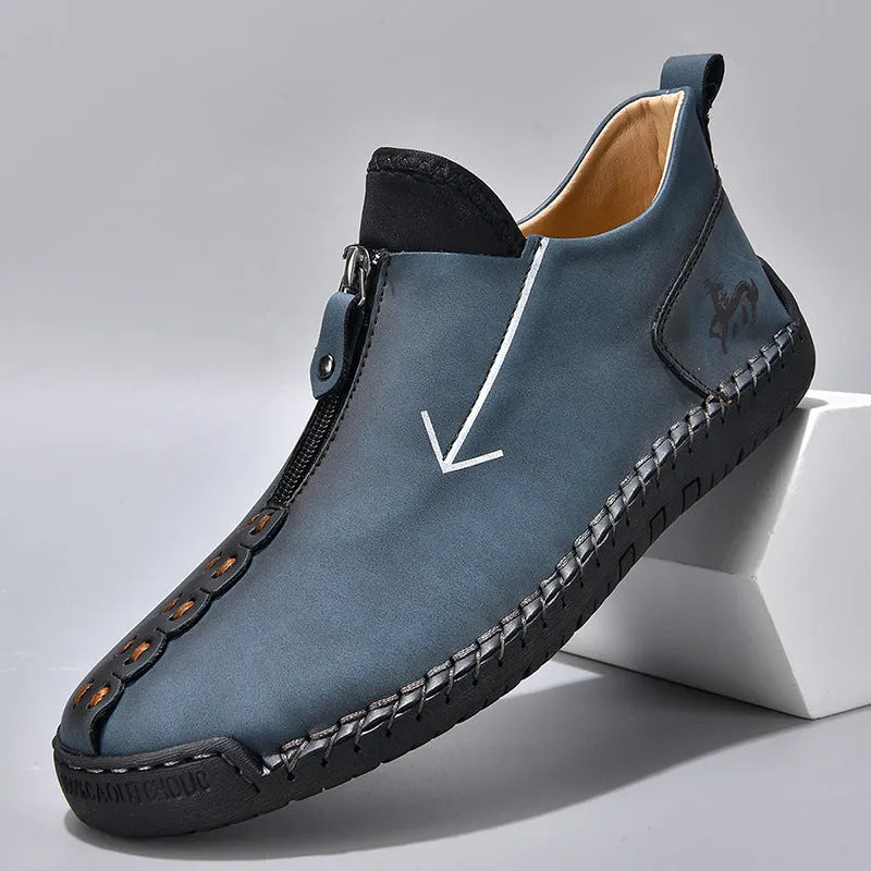 Men's black zip-up Martin boot with round toe and low heel on a white background.