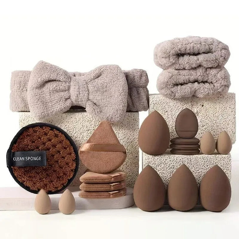 Beauty tool combination set with multiple pieces in pink, brown and purple colours for face wash and makeup application
