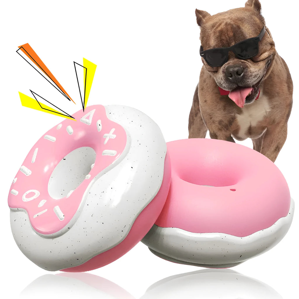 Pink TPR donut-shaped dog chew toy that makes a molar cleaning sound, shown next to a yellow and chocolate version.