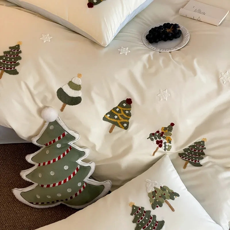 Pure cotton duvet cover set with embroidered Christmas trees and flowers, shown in cream blue colour.
