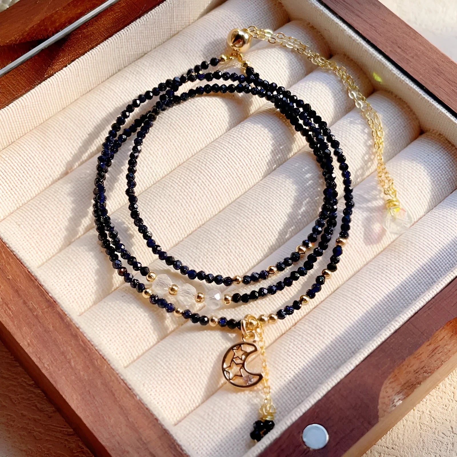 Women's handmade multi-layer bracelet with blue sand stone beads on three interlocking rings