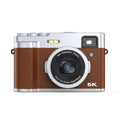Black 5K HD digital camera with optical viewfinder and 2.88-inch screen shown with included accessories.