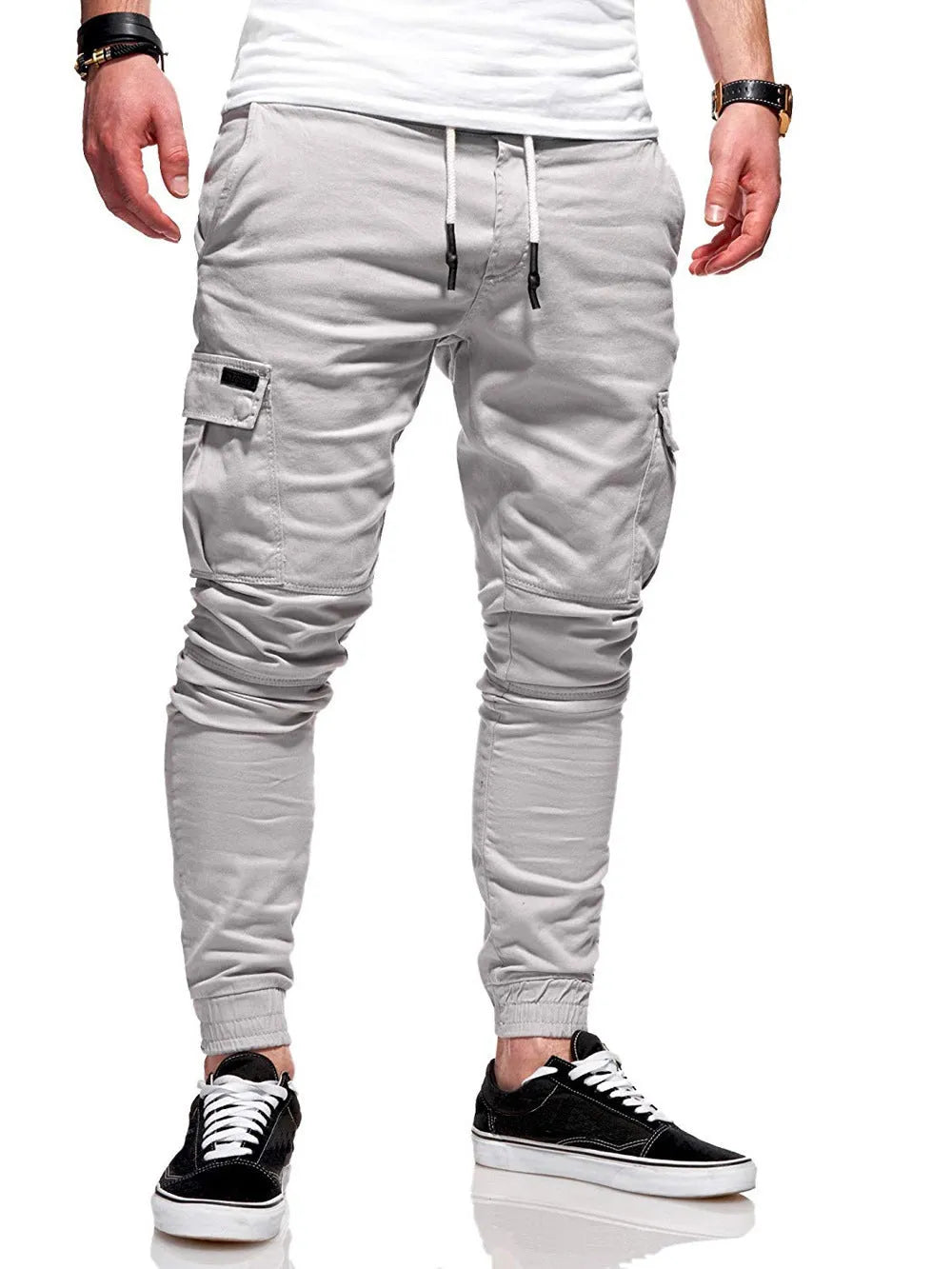 Men's loose-fit casual trousers with elastic waistband and patch pockets in army green colour
