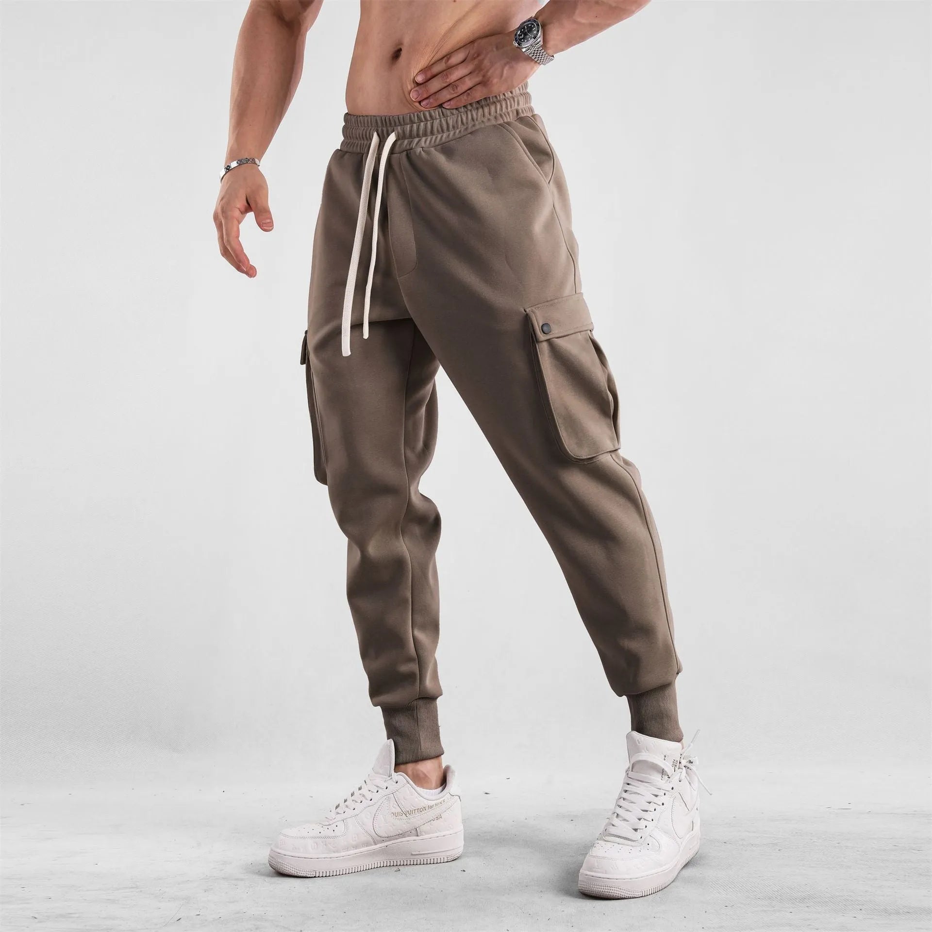 Men's loose cotton trousers with ankle tie fastening and multiple pockets in six colour options