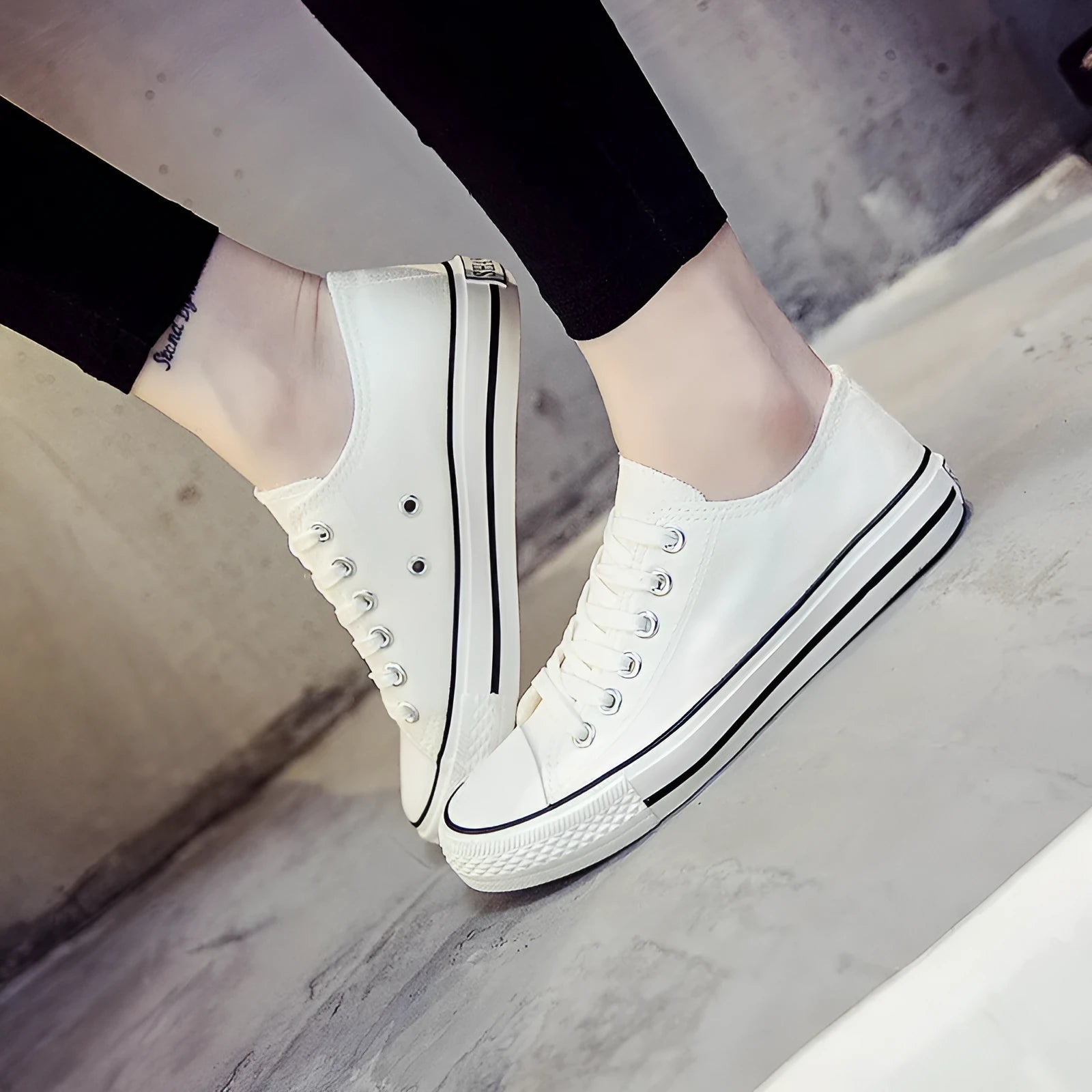 Women's solid-colour casual canvas shoes in black, white and black, white and red, or all black colourways.