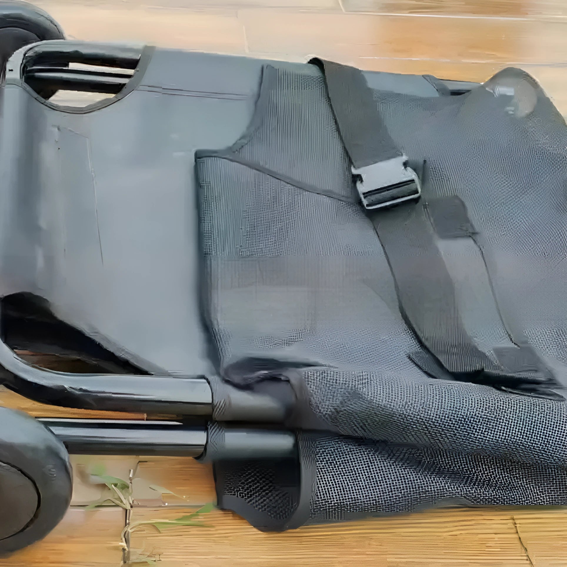Large black folding pet stretcher with aluminium alloy frame for emergency dog transfer.
