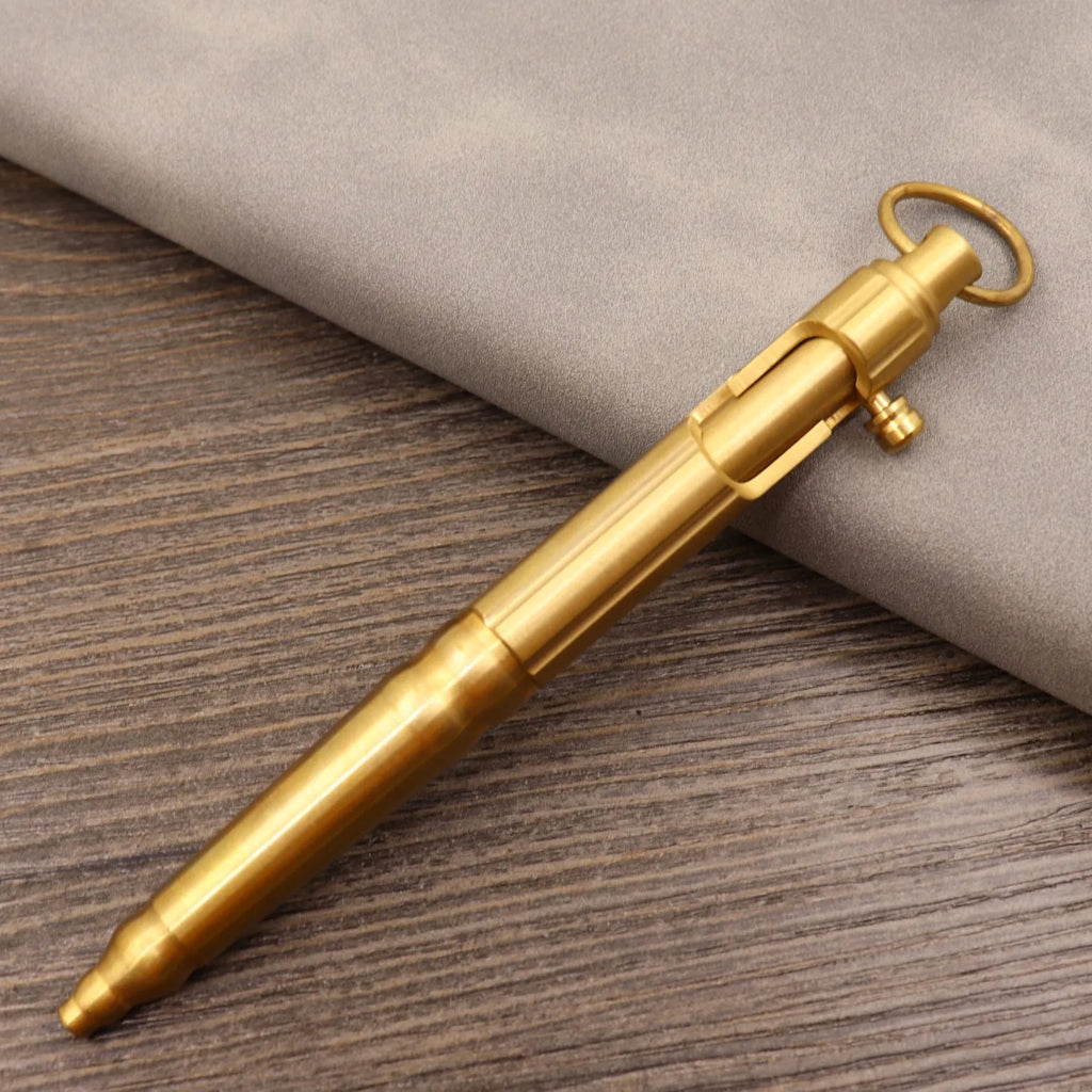 Brass tactical pen with bolt-action mechanism and retro colour finish