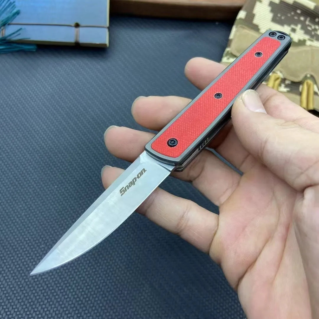 Folding fruit knife with stainless steel blade extended, showing black handle variant with blade measurements