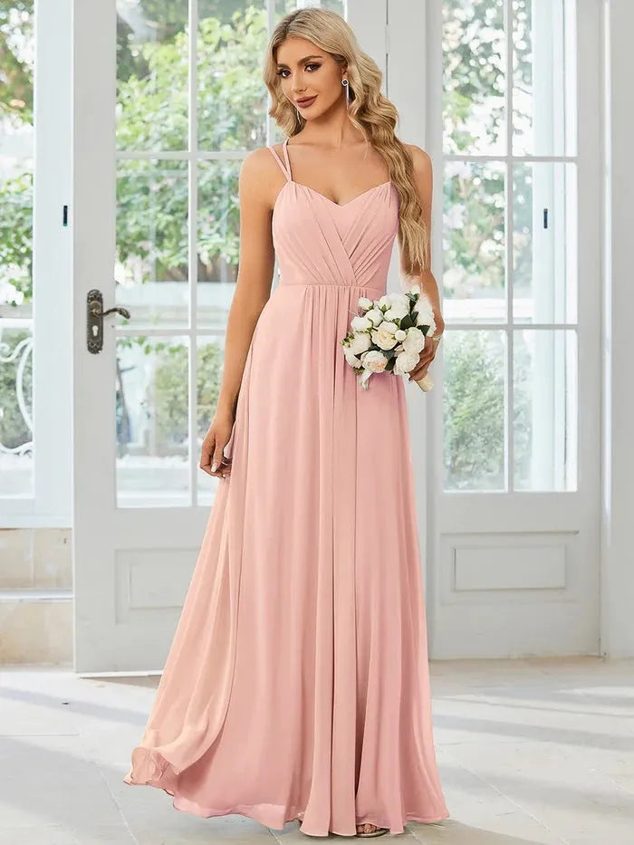 Women's sleeveless pleated A-line long dress in light green, shown in a solid colour with a long skirt.