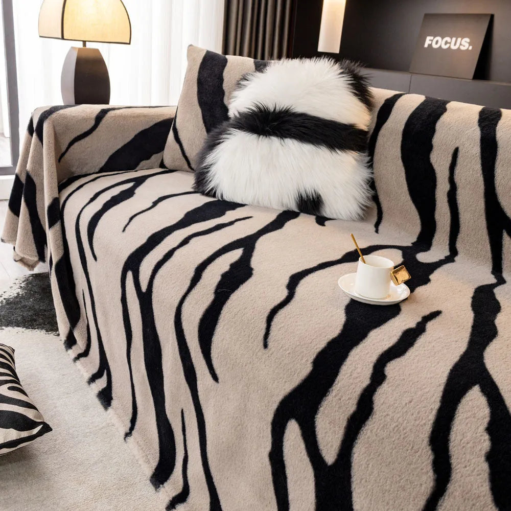 Zebra pattern non-slip flannel sofa cover with matching pillowcase in caramel colour.