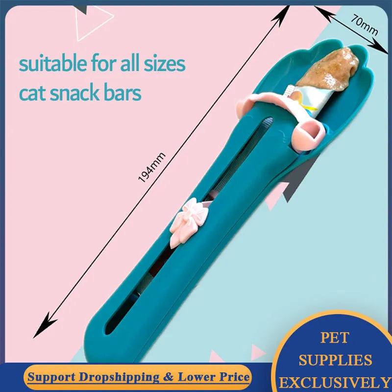 Green and pink pet feed spoon with silicone barrel for squeezing out sticky dog or cat food.