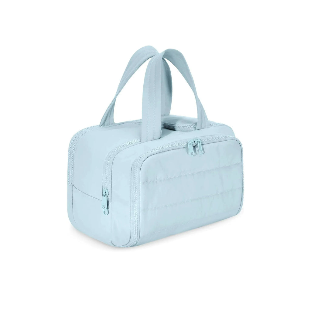 Large lightweight travel toiletry bag in black with wide opening, showing fluffy polyester material.