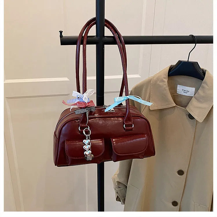 Retro women's pillow bag in PU leather with double shoulder straps and flap closure