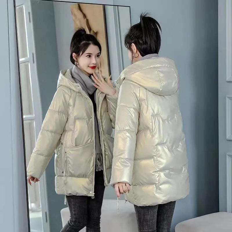 A women's loose-fit hooded winter jacket in a thick padded design, shown in one of four colour options.