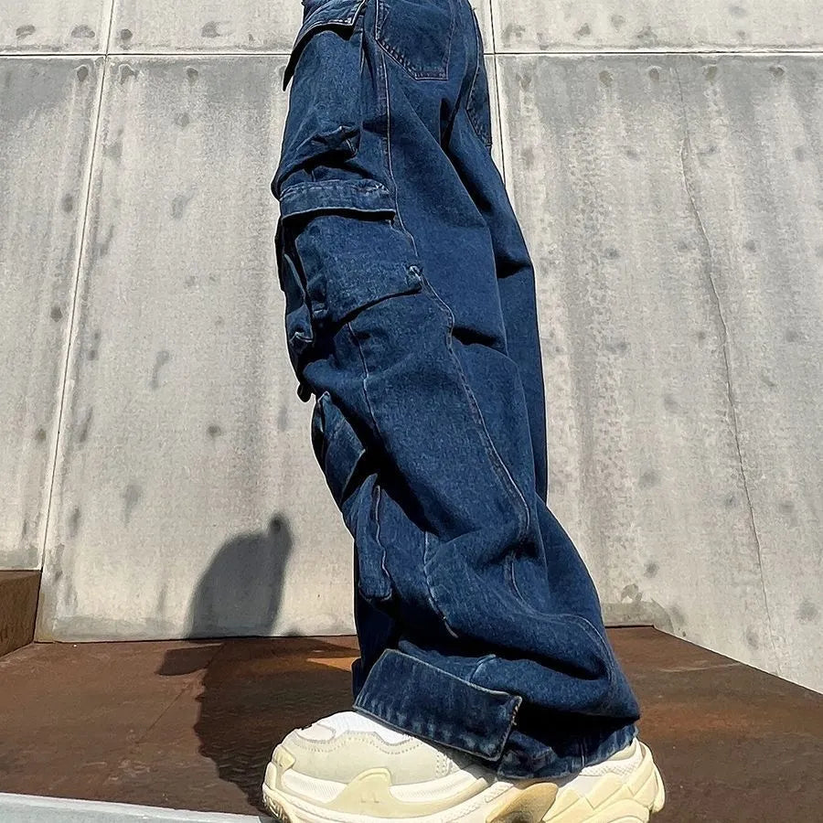 Dark blue distressed wide-leg women's jeans with high waist and multiple pockets in workwear style