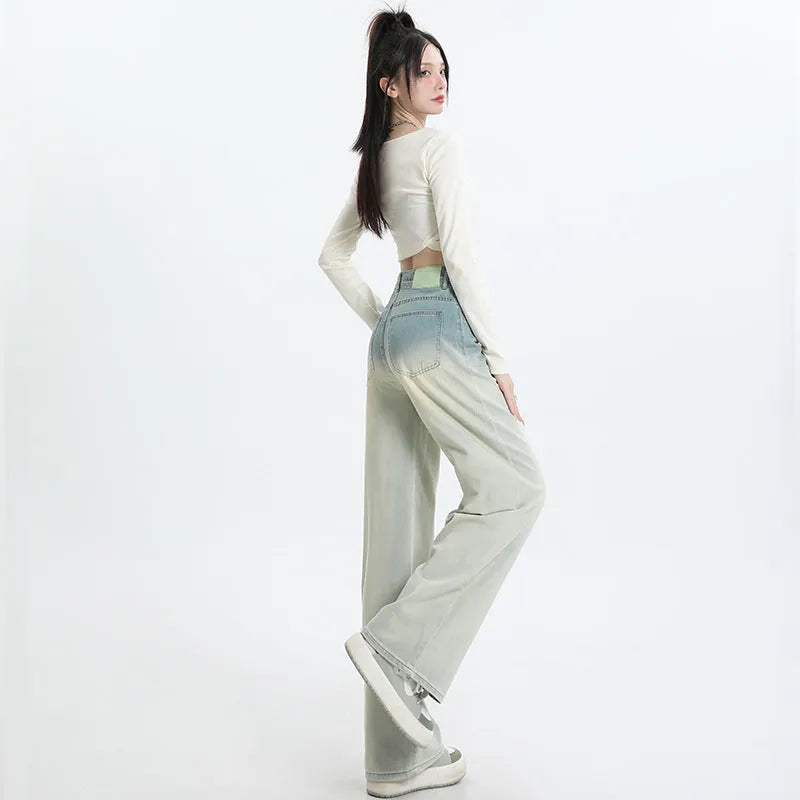 Gradient blue women's straight-leg denim trousers showing colour variation from light to dark blue tones