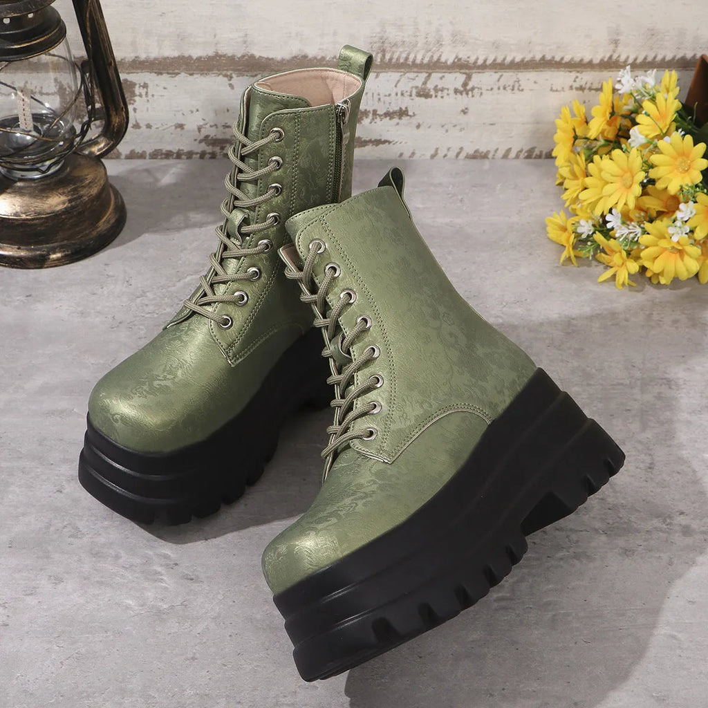 Women's black retro platform boots with patchwork round toe and side zip.