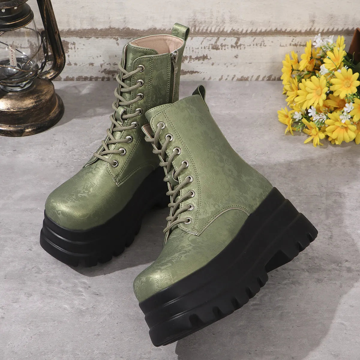 Women's black retro platform boots with patchwork round toe and side zip.