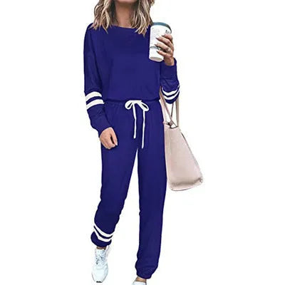 Women's plus size casual suit set in loose-fitting design with half-sleeve top and solid colour trousers