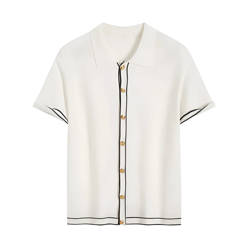 White short-sleeved cardigan with dark contrast lapels laid flat.