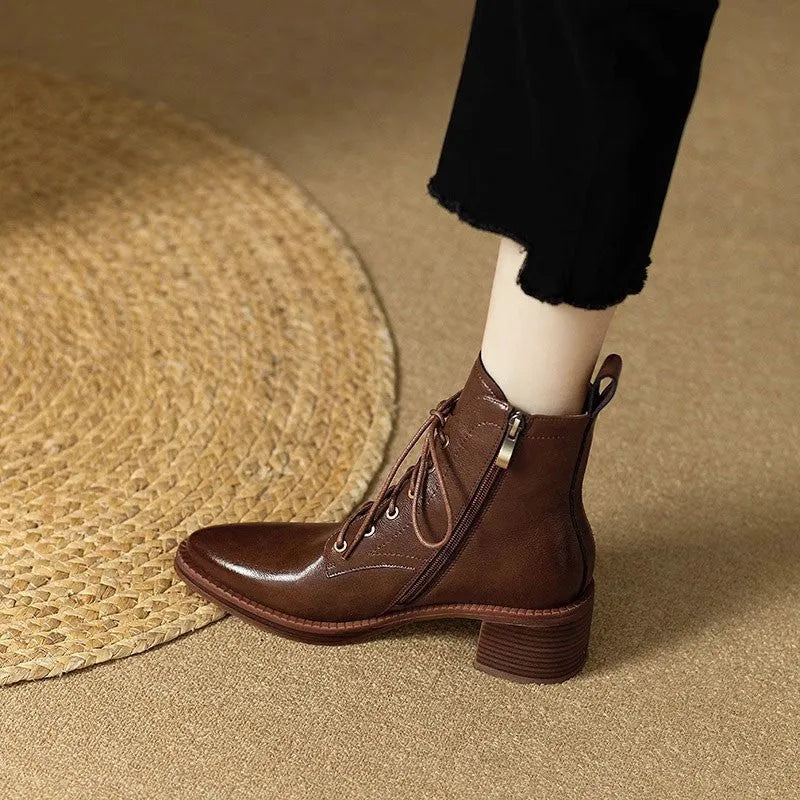 Women's black pointed toe short tube boots with 5.5cm block heel and ankle shaft height