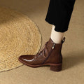 Women's black pointed toe short tube boots with 5.5cm block heel and ankle shaft height