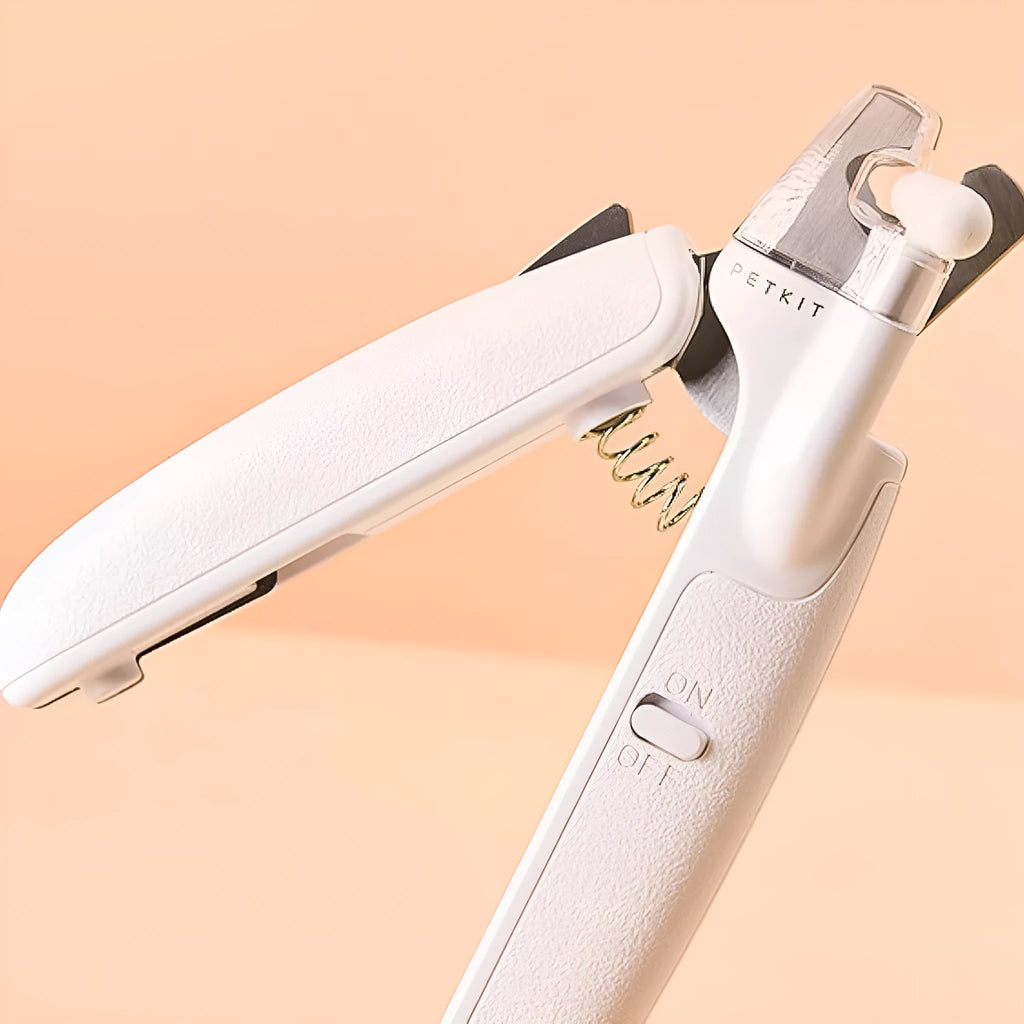 White pet nail clippers with LED light, transparent anti-splash guard and triangular blade for dogs and cats