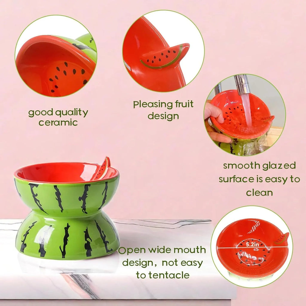 Ceramic elevated cat bowl with tilted surface in a colourful fruit pattern, showing its height and wide design.