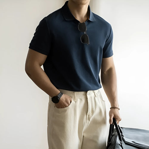 Blue cotton polyester blend short-sleeved polo shirt on a hanger, showing regular fit and casual style.