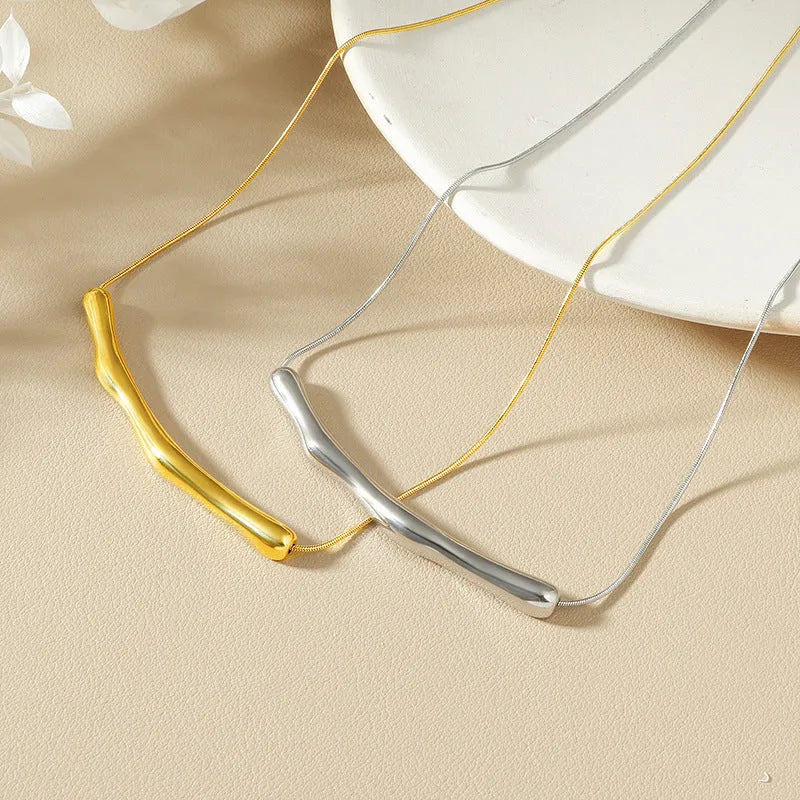Women's titanium steel necklace with a textured irregular pleated design, shown in gold and steel colour options.