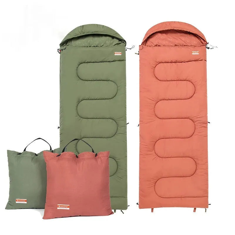 Cotton camping sleeping bag quilt in ochre or olive green colour folded for transport