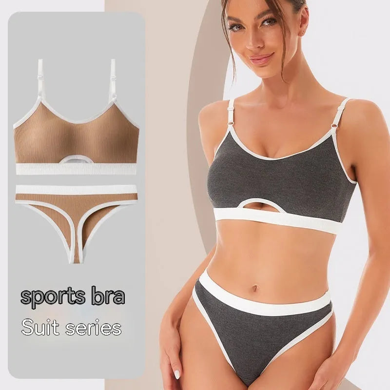 White sports underwear vest with contrast back detail and matching underwear, shown on a hanger.