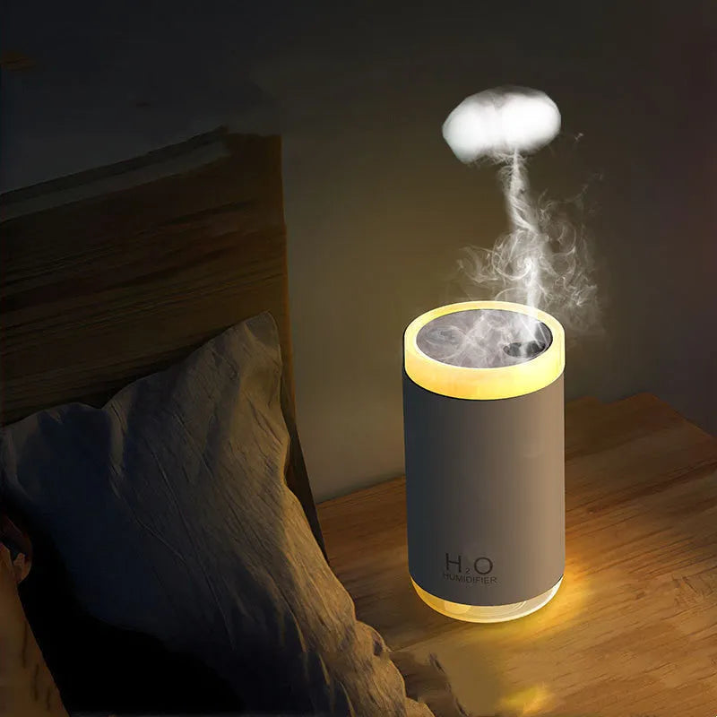 White jellyfish design USB humidifier with nano mist and warm night light on a desk