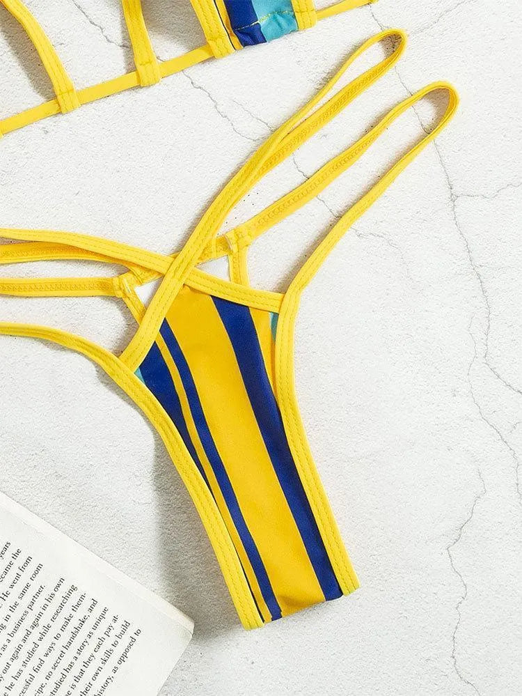 Yellow women's neck-hanging split swimsuit with backless design and high-waist shorts.