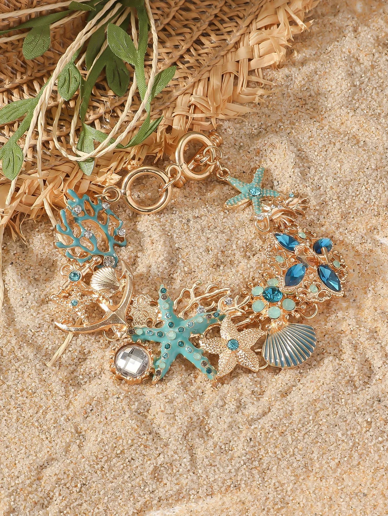 Alloy marine shell boat anchor rhinestone bracelet with starfish details in turquoise colour.