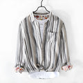 Red and grey striped linen shirt for men on a hanger, showing long sleeves and loose casual fit.