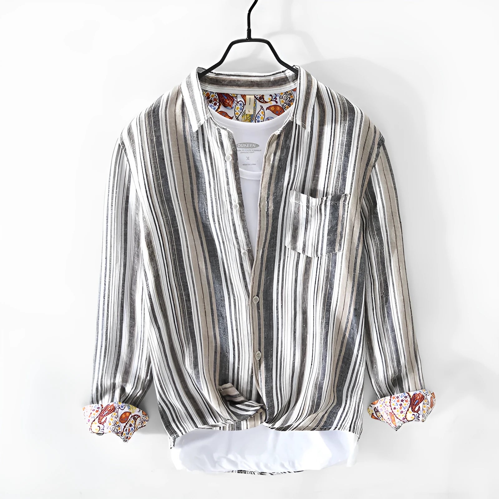 Red and grey striped linen shirt for men on a hanger, showing long sleeves and loose casual fit.