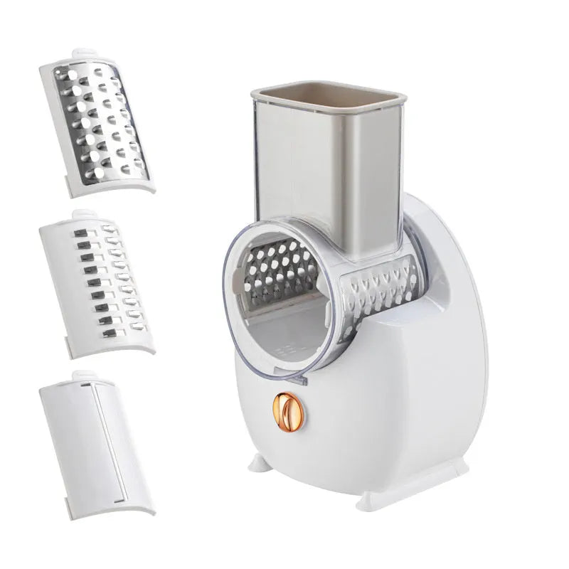 White electric vegetable slicer with rotary grater, feeding port, and strong suction base on a kitchen counter.