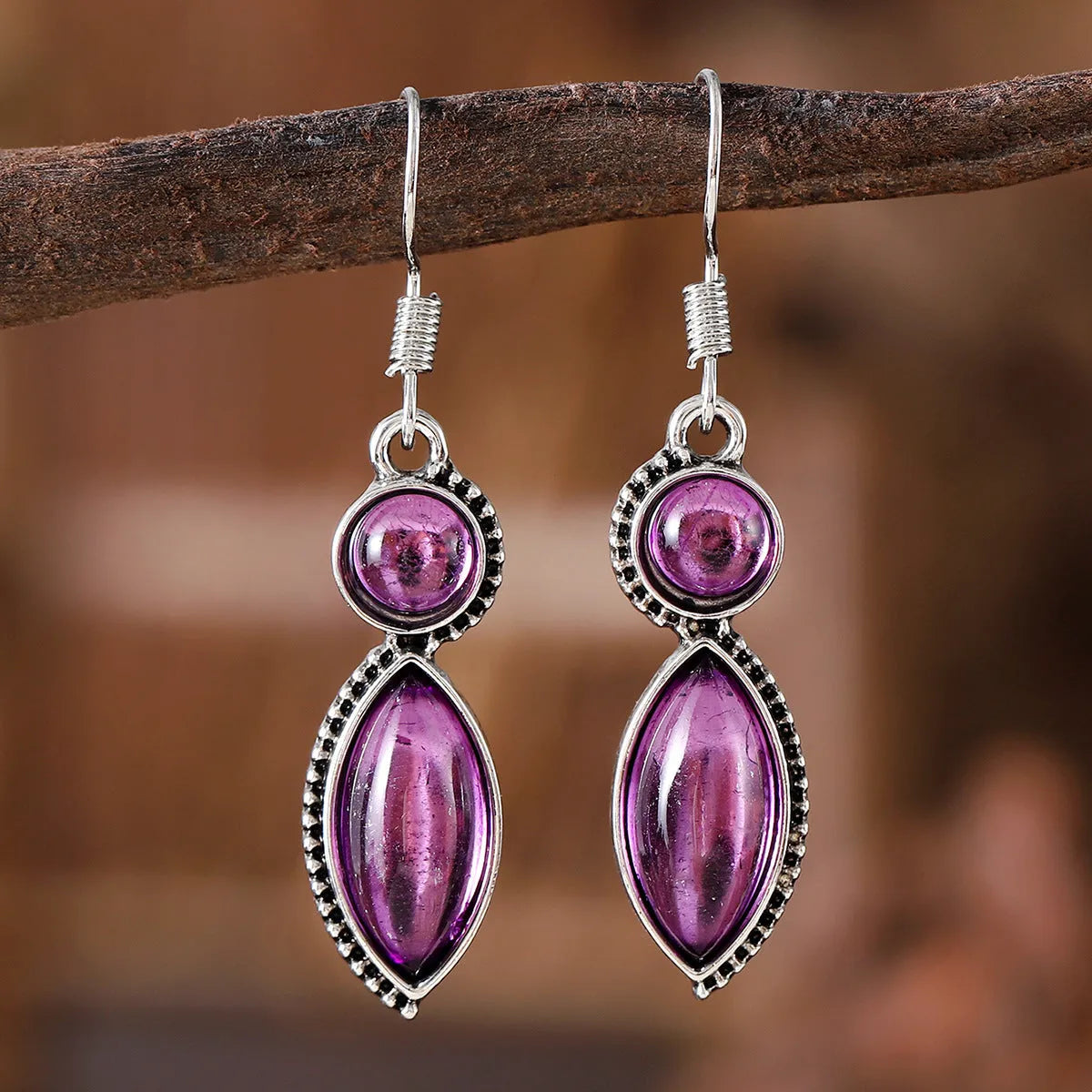 Vintage geometric zinc alloy earrings with electroplated black or purple colour and round pendant elements