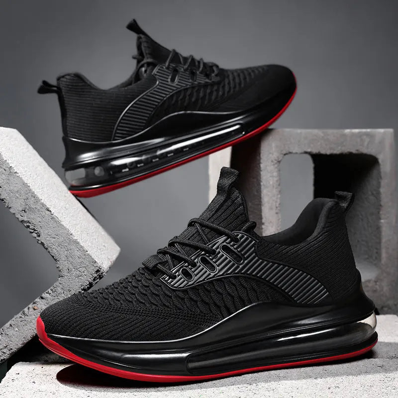 Men's black low-top mesh running shoes with round toe and lace-up front on a white background.