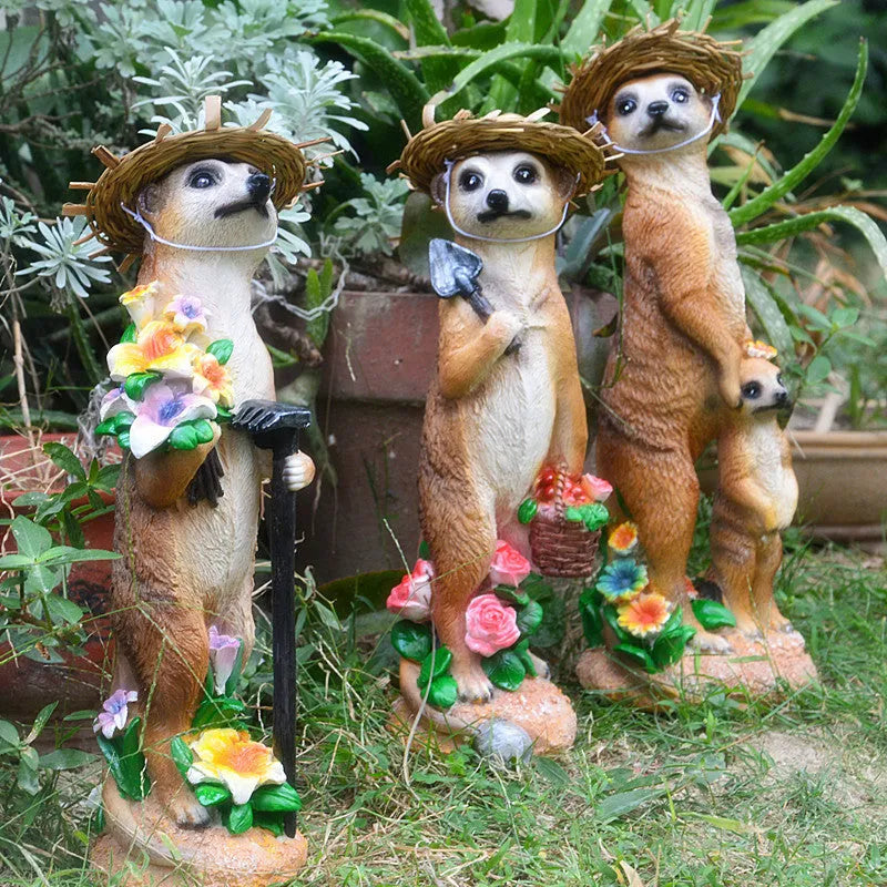 Straw hat mongoose garden ornament crafted from synthetic resin in three colour variations