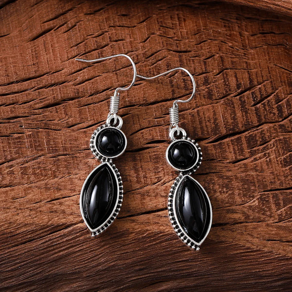 Vintage geometric zinc alloy earrings with electroplated black or purple colour and round pendant elements