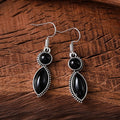 Vintage geometric zinc alloy earrings with electroplated black or purple colour and round pendant elements