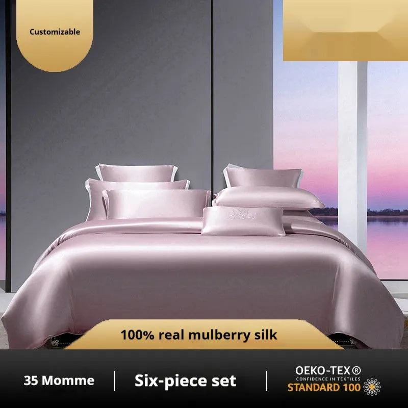 Silk four-piece quilt cover set in a solid colour displayed on a bed, showing the quilt cover and matching pillowcases.
