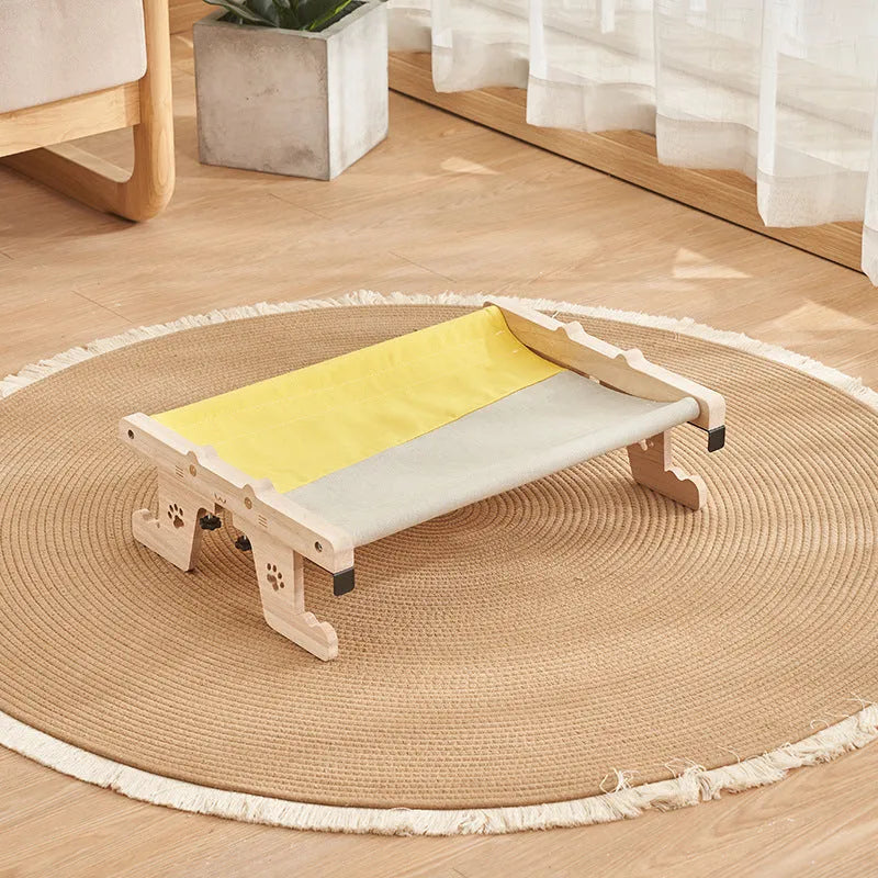 Wooden cat hanging bed hammock mounted on a balcony railing