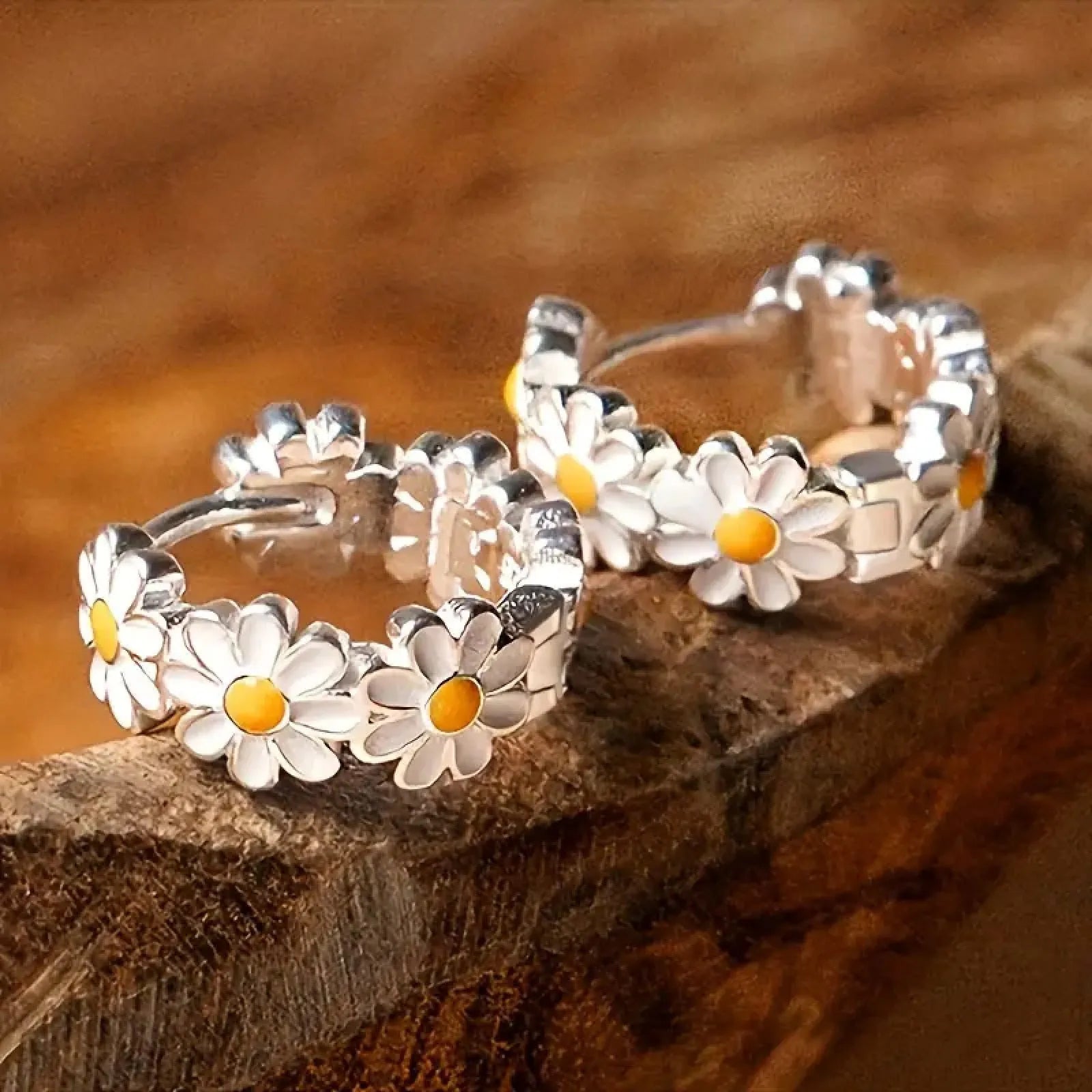 White daisy flower ring style fashion earrings with inlaid gems on a model or plain background.