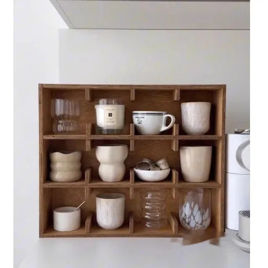 Solid wood square cup storage rack with multiple grid compartments in a birch wood meridian colour.