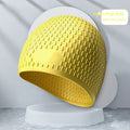 Silicone adult swimming cap with water drop texture in solid colour options on white background.