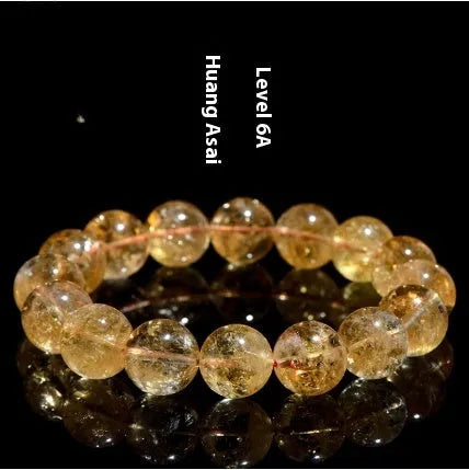 Natural yellow citrine gemstone bead bracelet showing geometrical beads on a string.